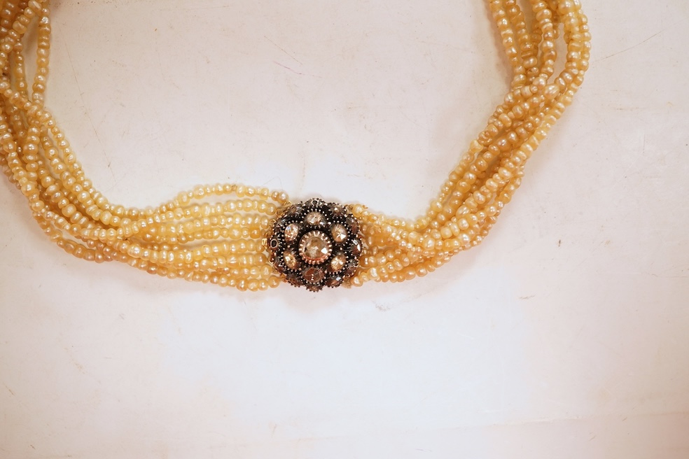 An eight-strand seed pearl choker necklace, with a rose-cut diamond clasp, length 34cm, pearls untested; together with a single strand graduated cultured pearl necklace, length 40cm, clasp stamped 9ct, Condition: good, s